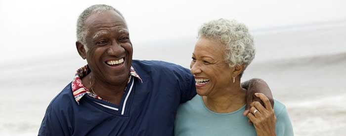 Happy elderly couple at the sea shore